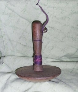 An old drop spindle? Or a giant darning mushroom?