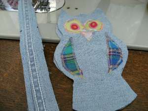 Cut out decorations for front & applique on with zigzag stitches, if appropriate